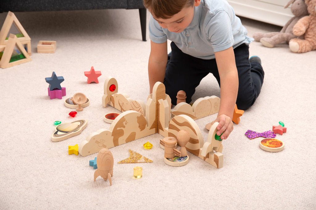 Space-themed wooden divider set with planet, rocket, and star pieces for play