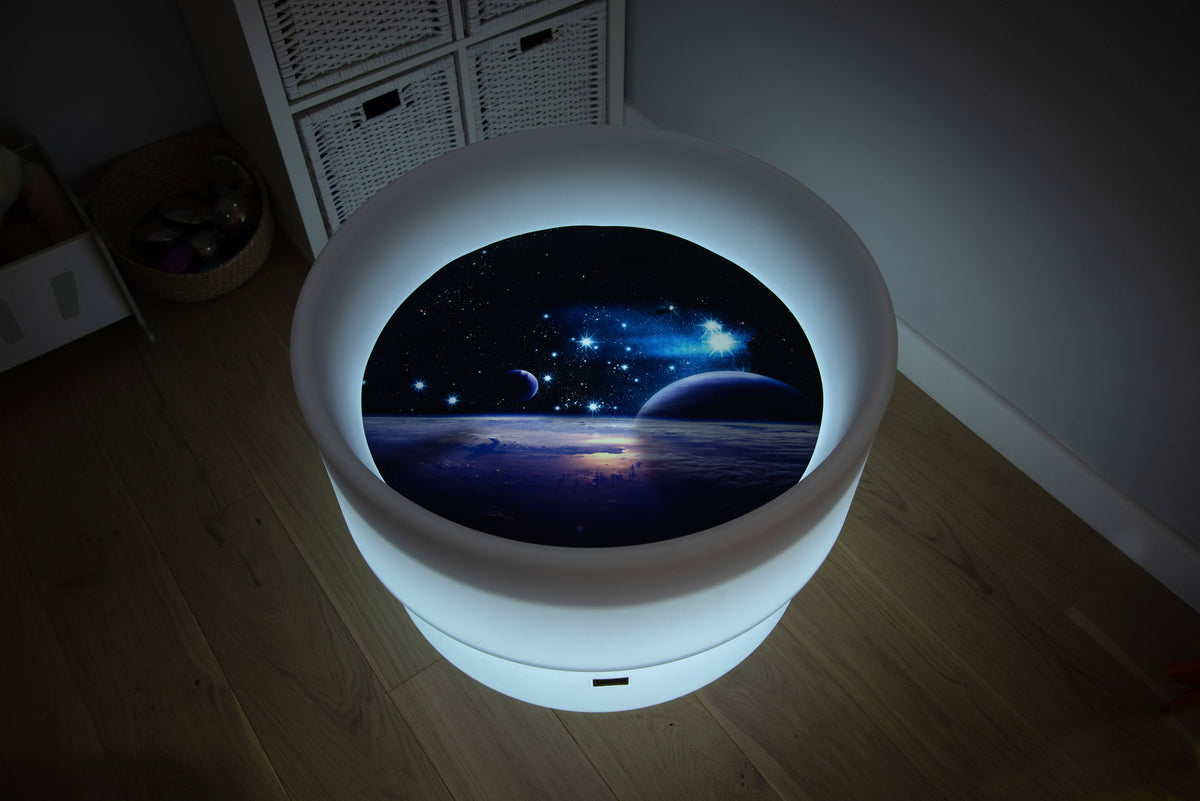 Round space play mat with cool white glowing LED border and planet scene