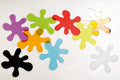 Colorful foam puzzle pieces in star, flower, and splash shapes
