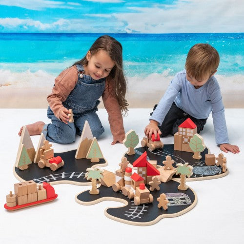 Story Island wooden train track playset with buildings, trees, and car figures