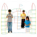 Colorful plastic straw tubes and connectors forming a tall geometric play structure