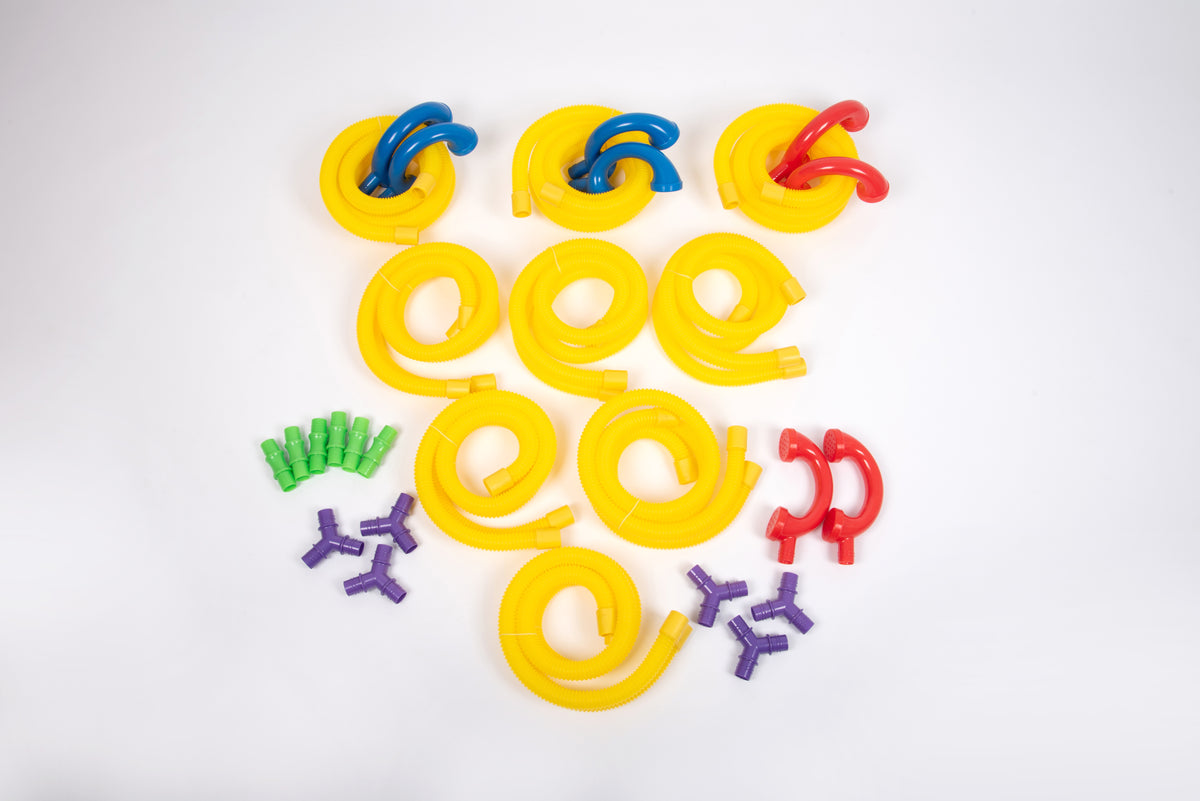 Mixed yellow, blue and red tube loops with purple and green connectors on white