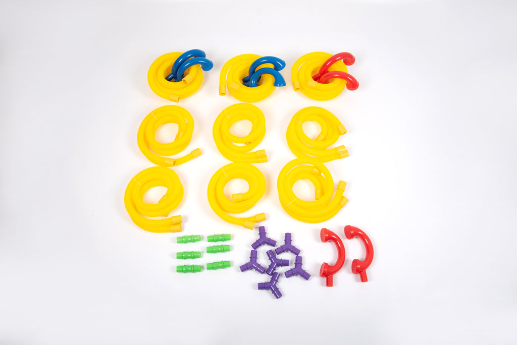 Yellow, blue and red coiled tube pieces with purple and green connectors on white
