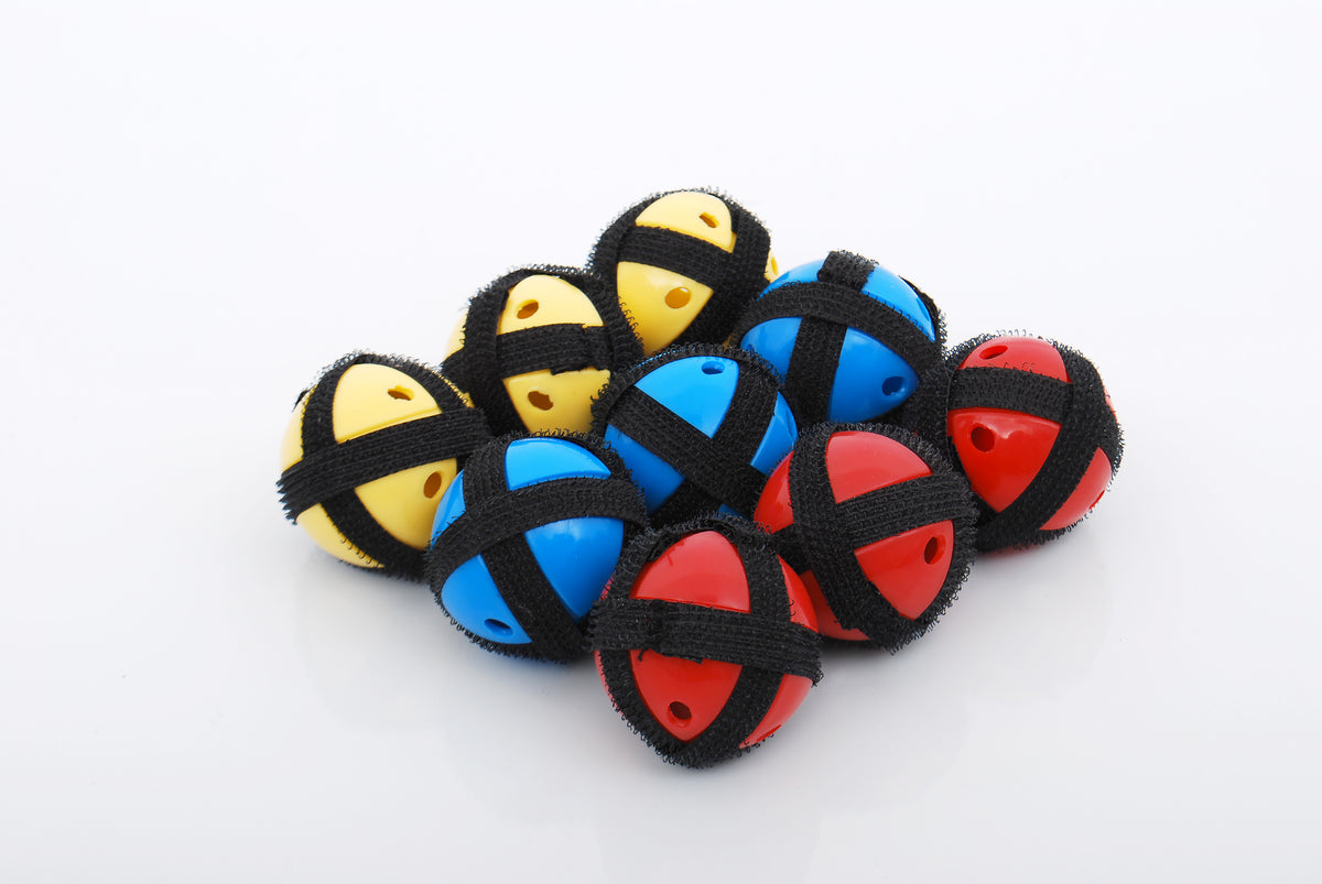Foam math balls in blue, black, red, and yellow with smiley faces, loose together