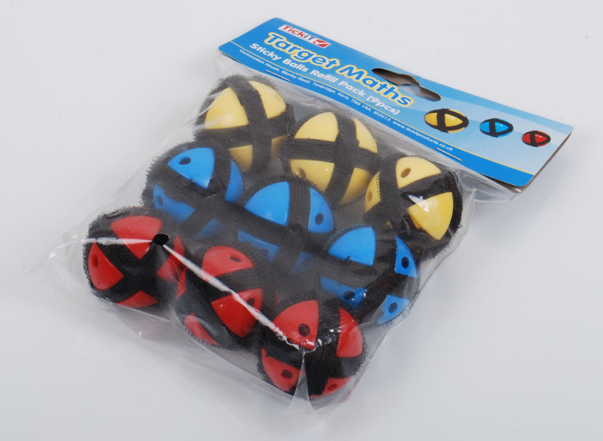 Foam math balls set in blue, black, red, and yellow smiley faces, in a clear bag