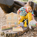 Wooden dollhouse playset with shutters and garden accessories, light beige