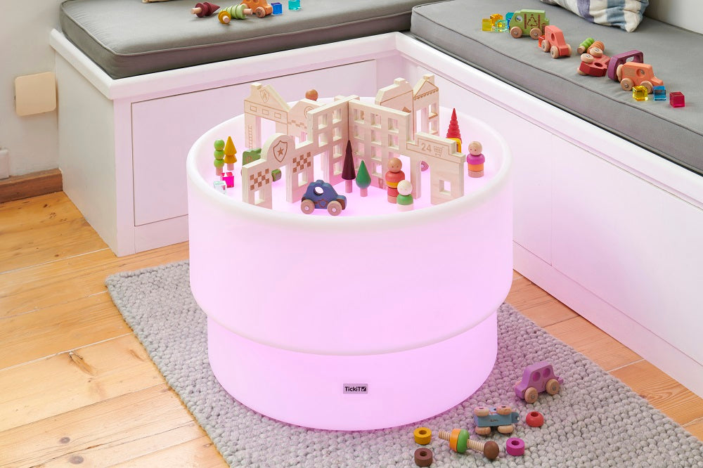 Town discovery dividers play set with wooden town walls, trees, and toys on a round unit