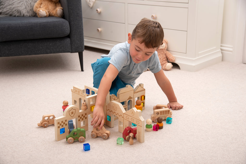 Town discovery dividers play set with wooden buildings and roads as a child plays