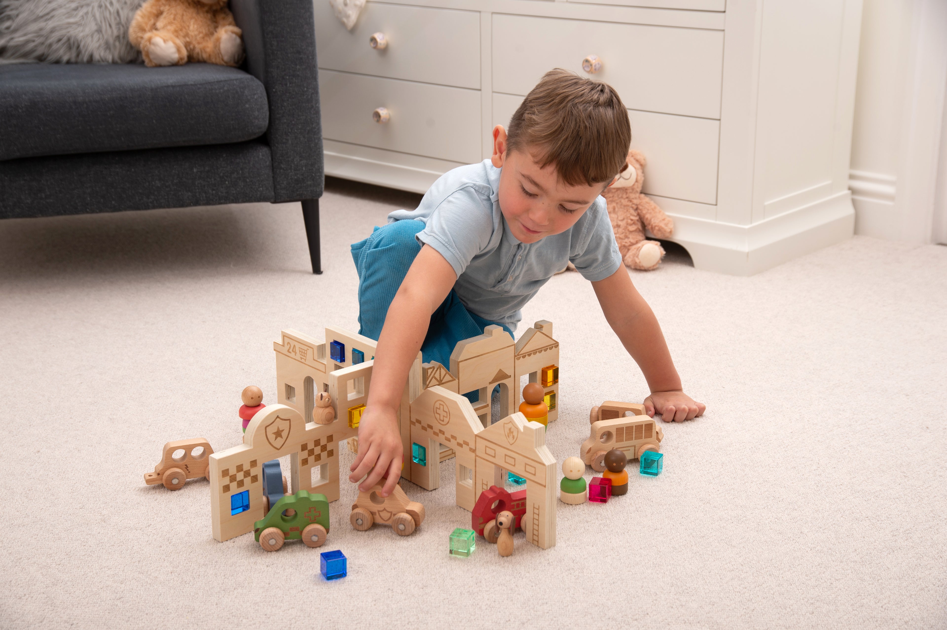 Town discovery dividers play set with wooden buildings and roads as a child plays