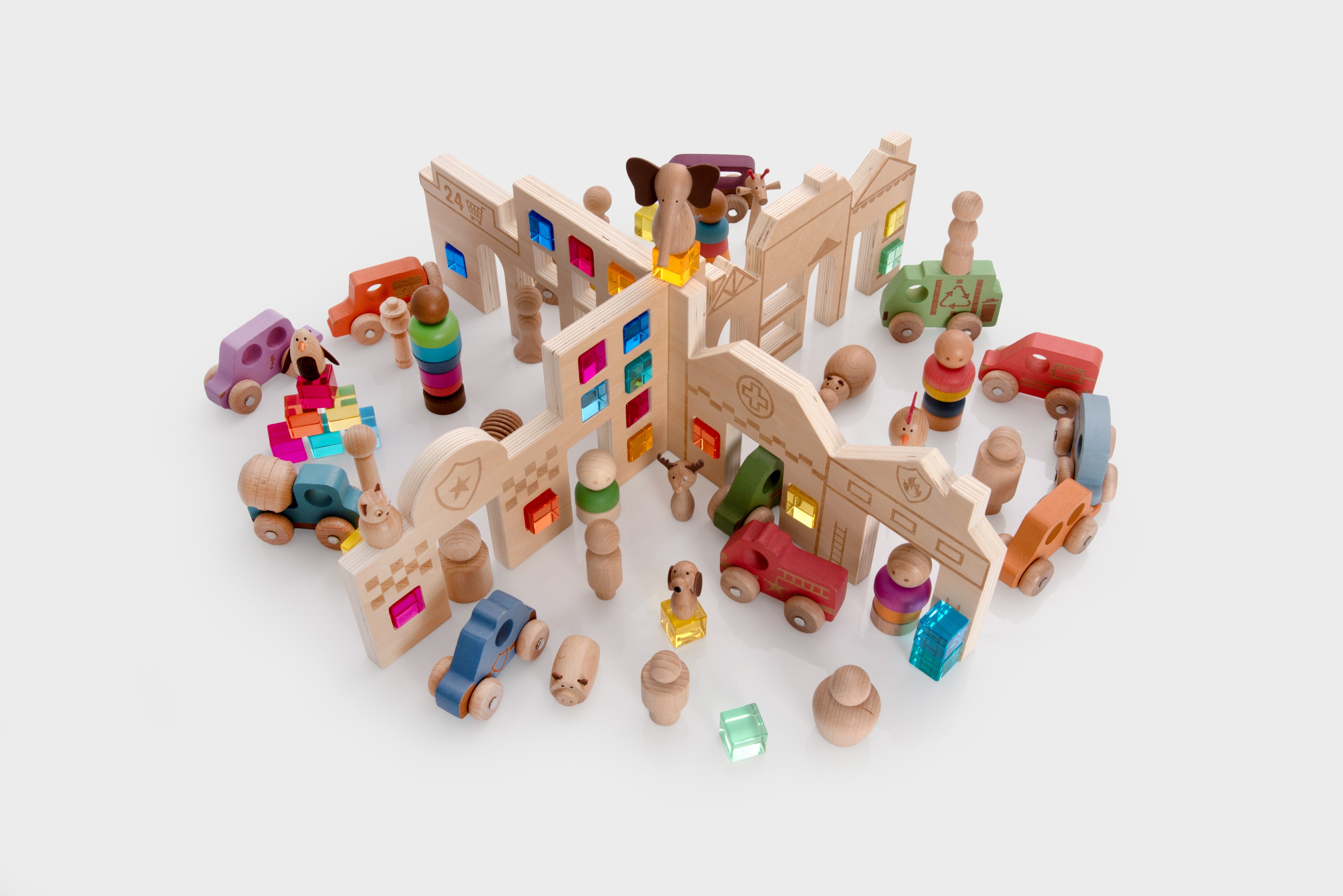 Wooden toy town set with buildings, figures, vehicles, and accessories