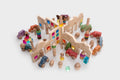 Wooden town playset with house pieces, mini figures, and toy vehicles