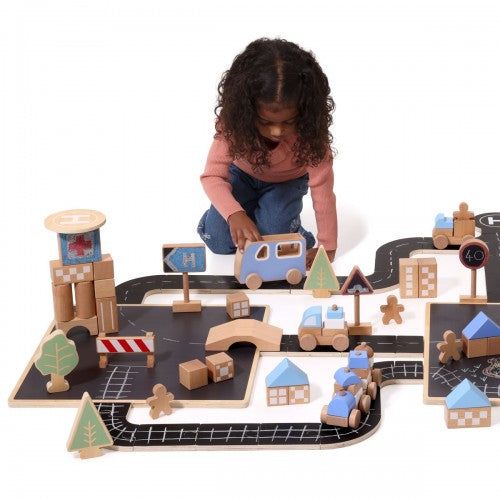 Wooden town travel play set with building blocks and cars on a foldable mat