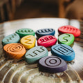 Multicolor letter-pattern tracing pebble set with rounded flat shapes