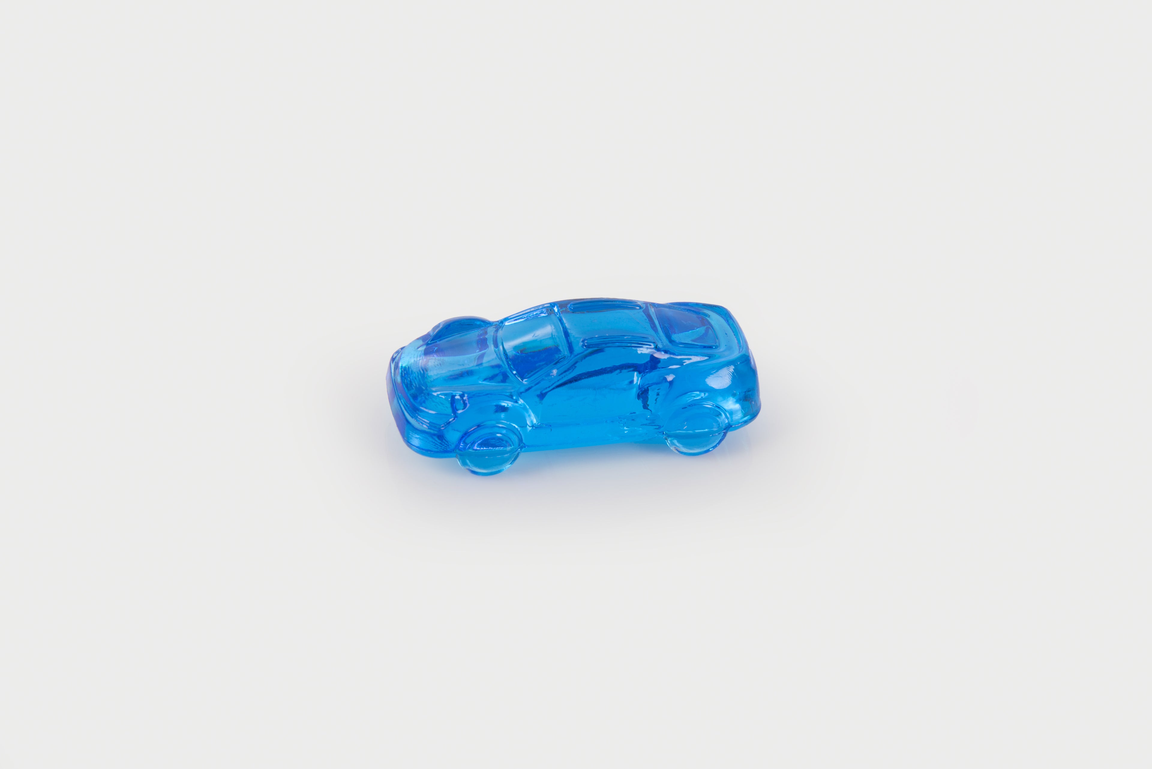 Translucent blue toy car with detailed window and wheel features