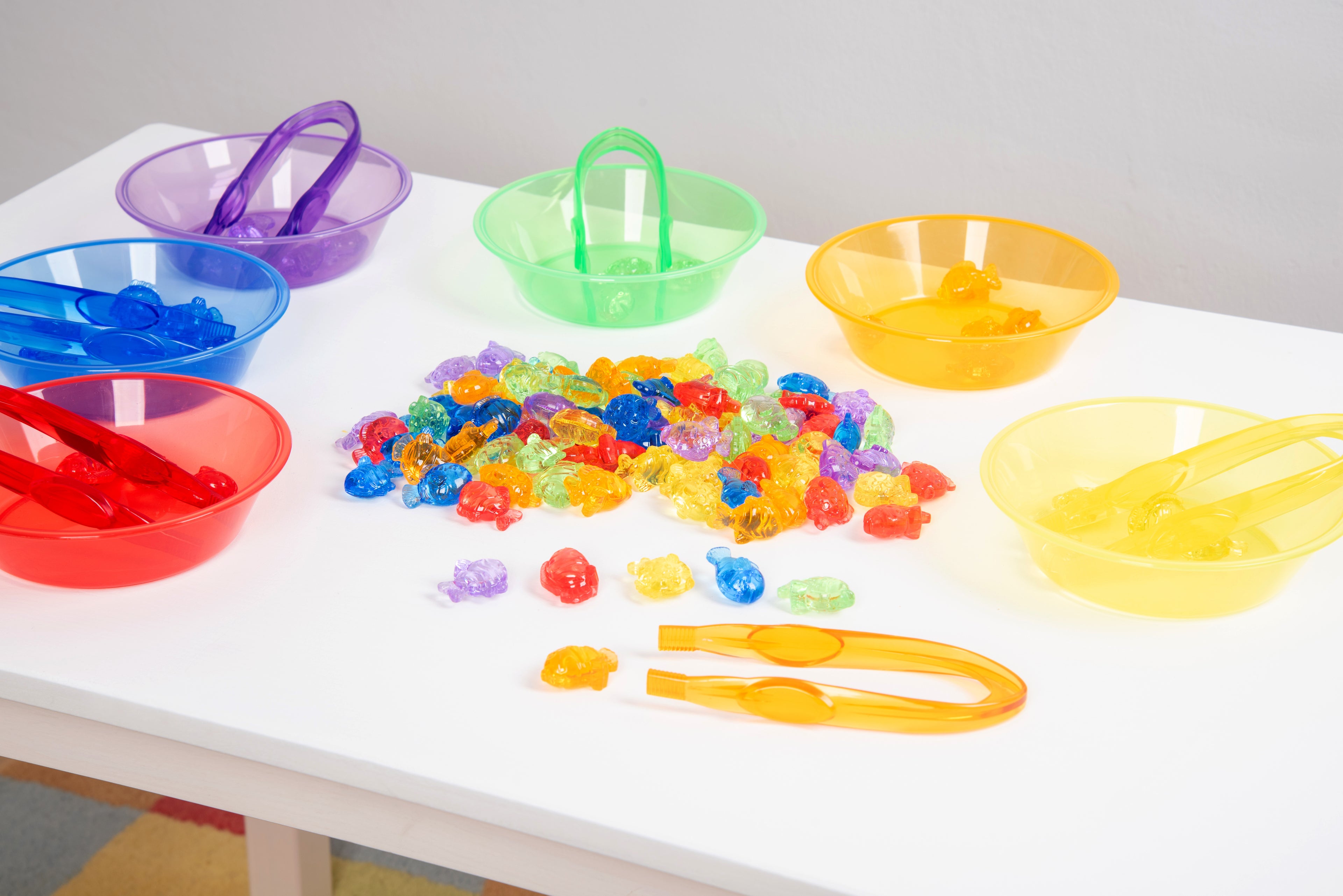 Translucent color fish set with translucent bowls, scoops, and multicolor fish pieces