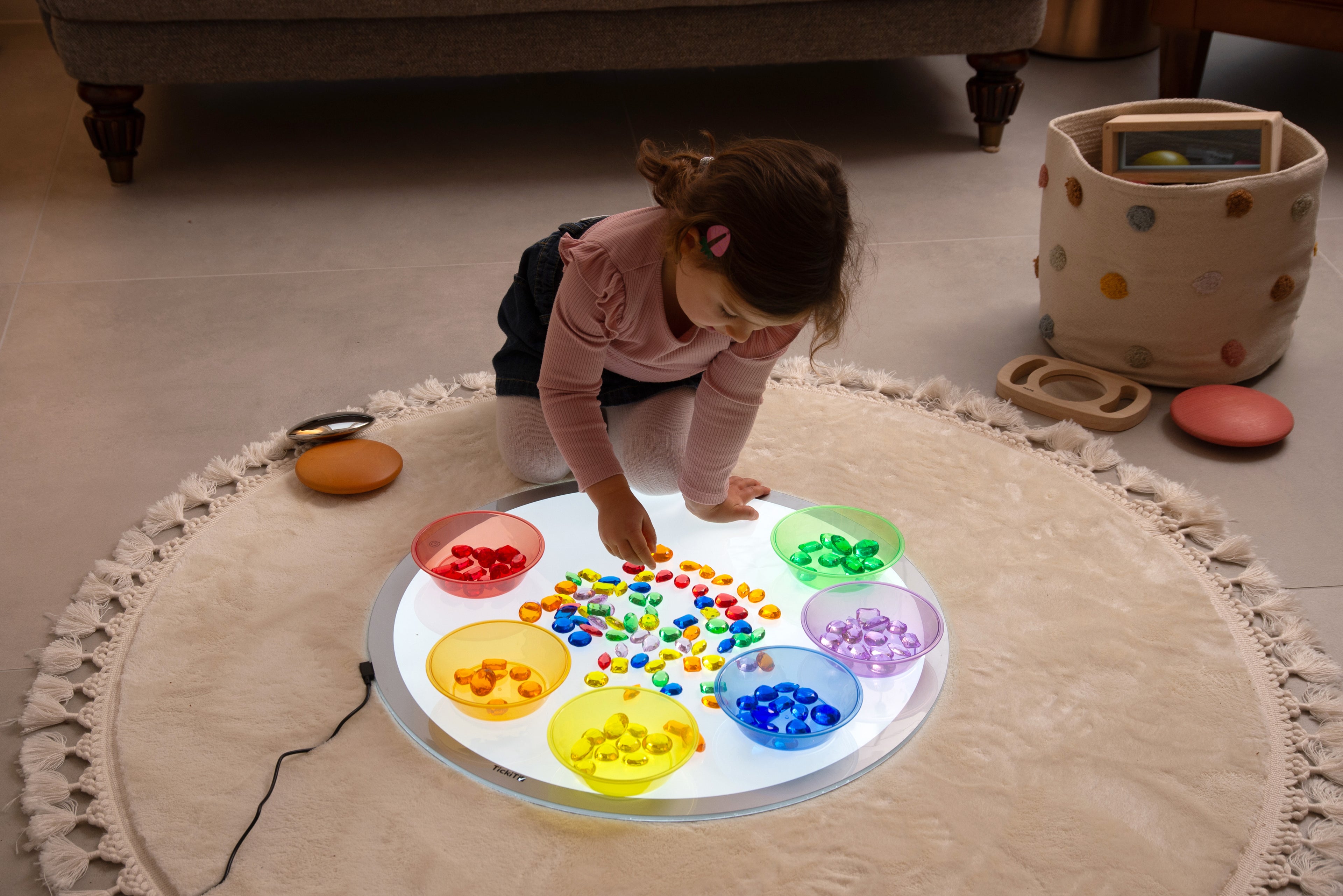 Translucent jewel gems set in round tray with colorful pieces and divided compartments
