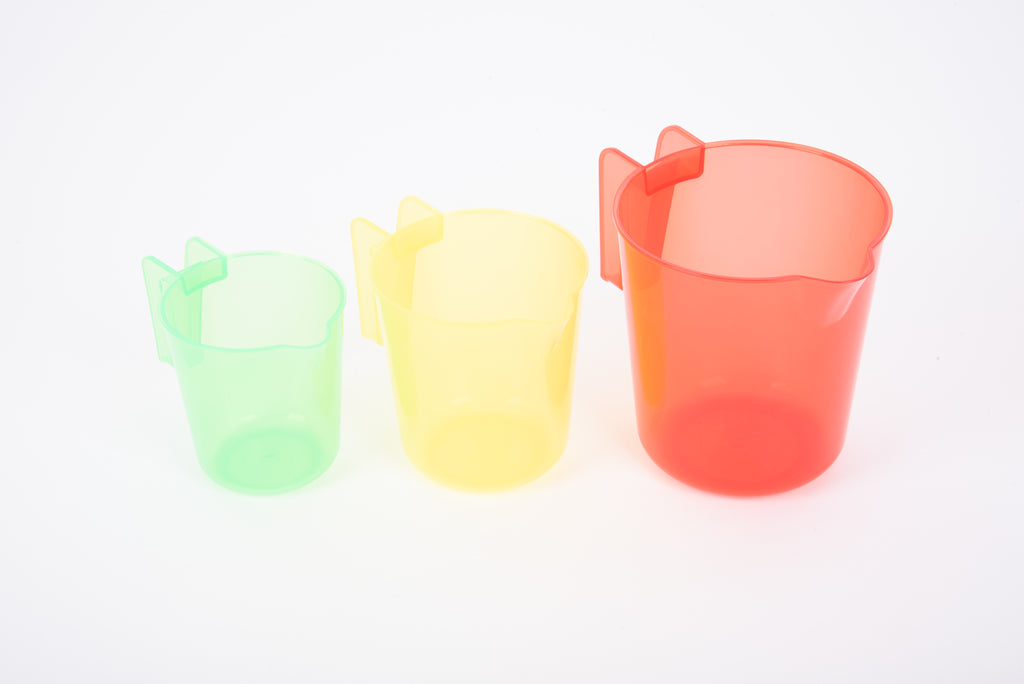 Translucent nesting jugs set: mint green, pale yellow, and coral red with handles