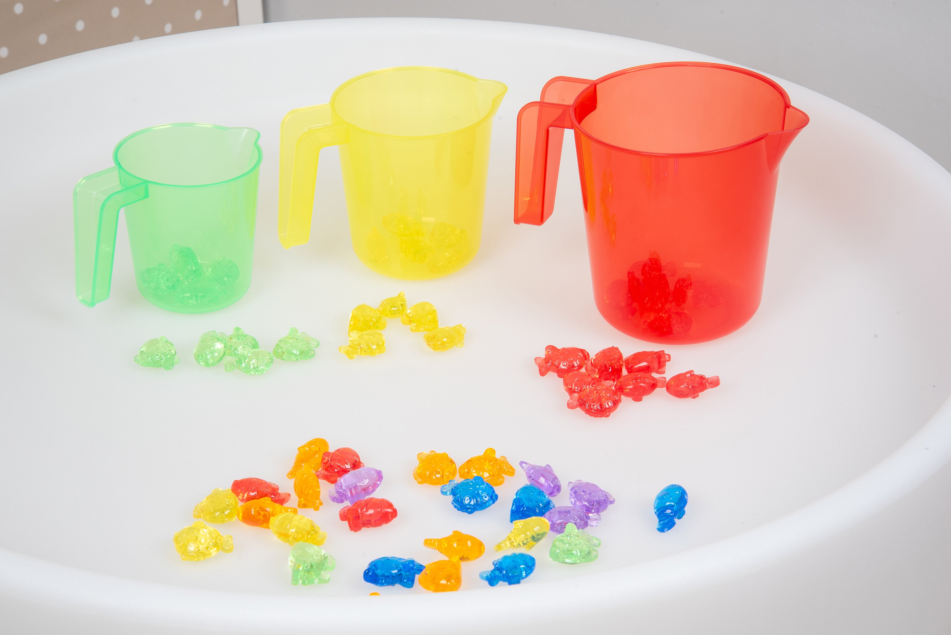 Translucent nesting jugs set with mint green, yellow and red cups plus colored beads
