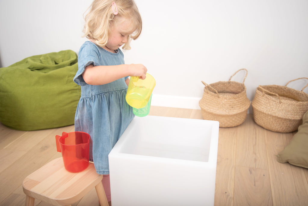 Translucent nesting jug, yellow-green translucent cup with handle and pour spout