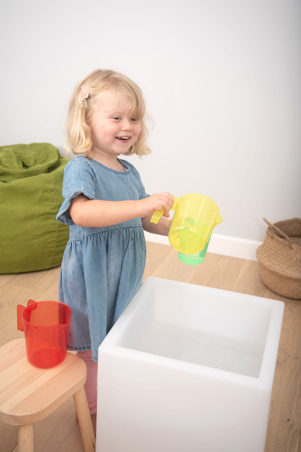 Translucent nesting jug, yellow with green tint, translucent body and pouring spout