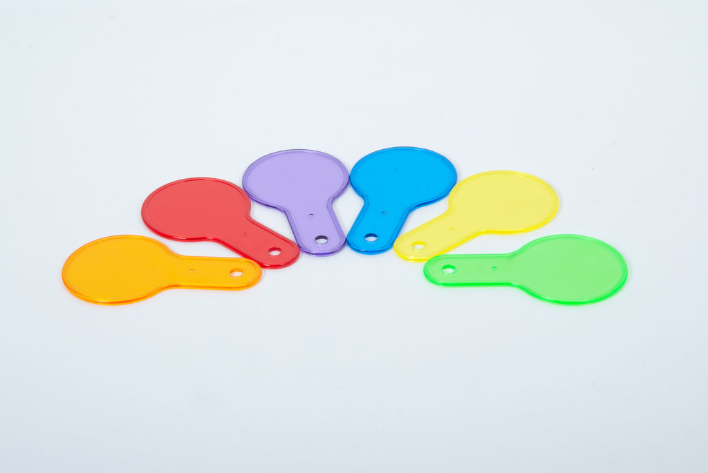 Set of translucent color paddle toys with handles: red, orange, yellow, green, blue, purple.