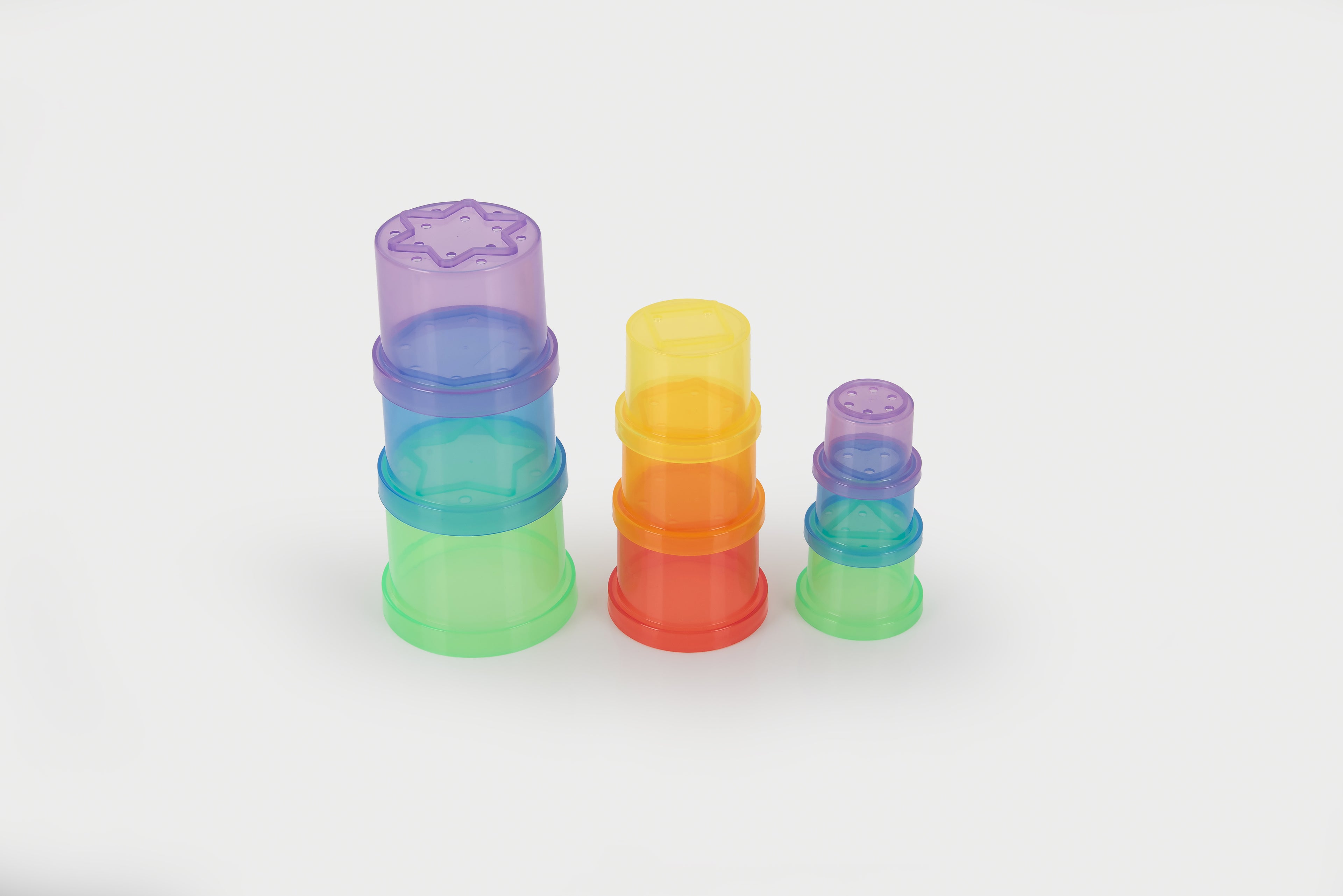 Translucent stacking cups set in assorted colors, nested and stacked for display.