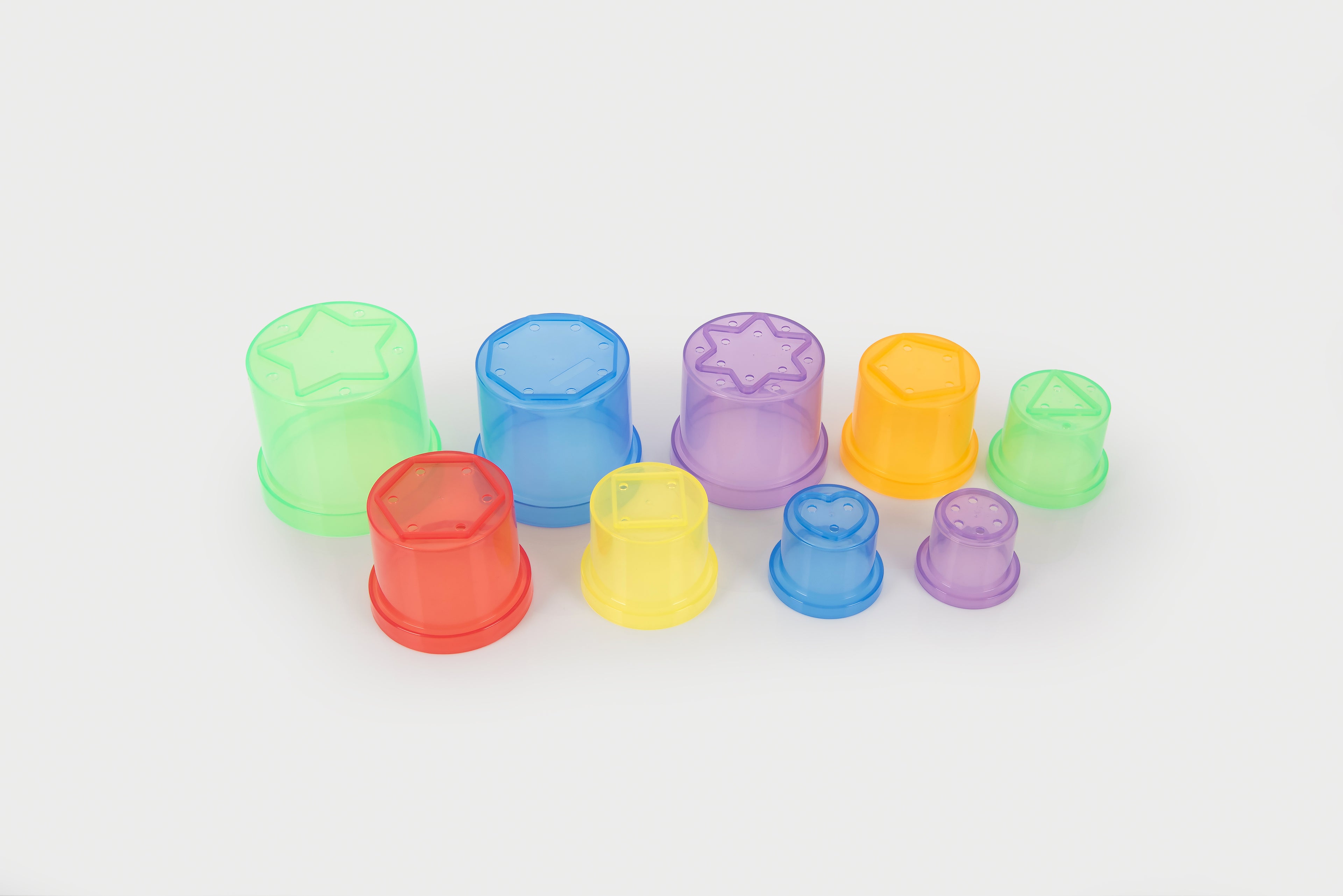 Translucent stacking cups in assorted colors, shown as a small row of cups.