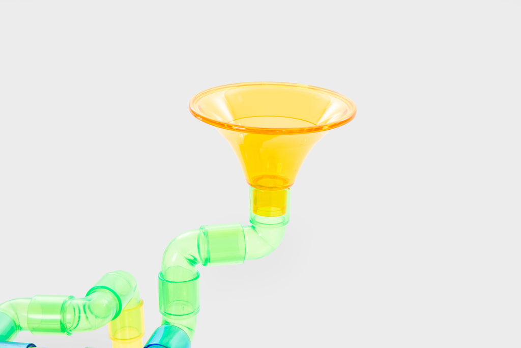 Translucent water pipe toy with yellow funnels and green curved tubes
