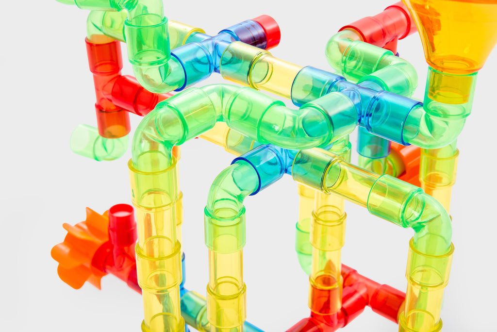 Translucent water pipe toy cluster with clear green, blue, red, and orange tubes