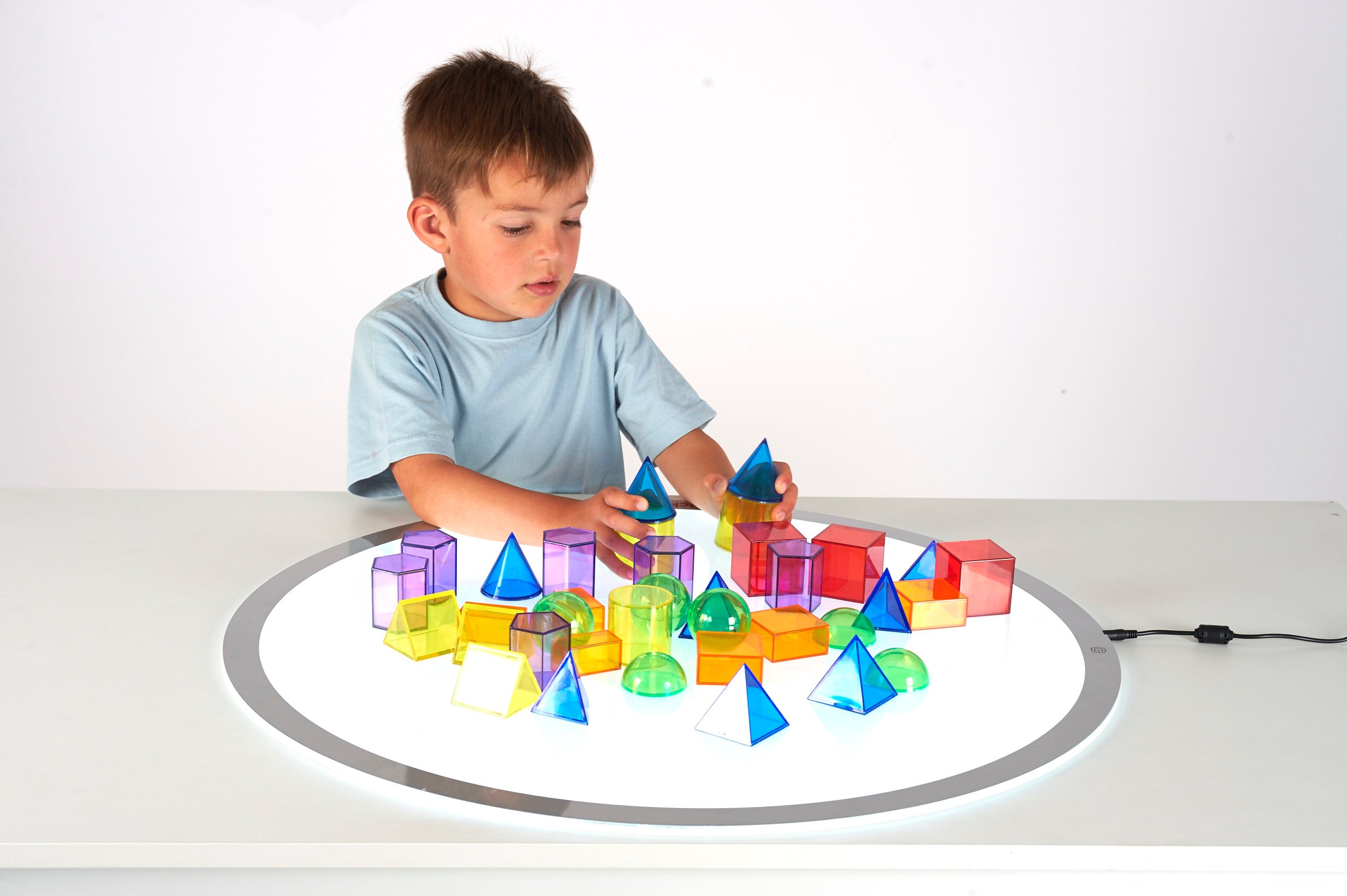 Translucent geometric shape toy blocks in assorted colors
