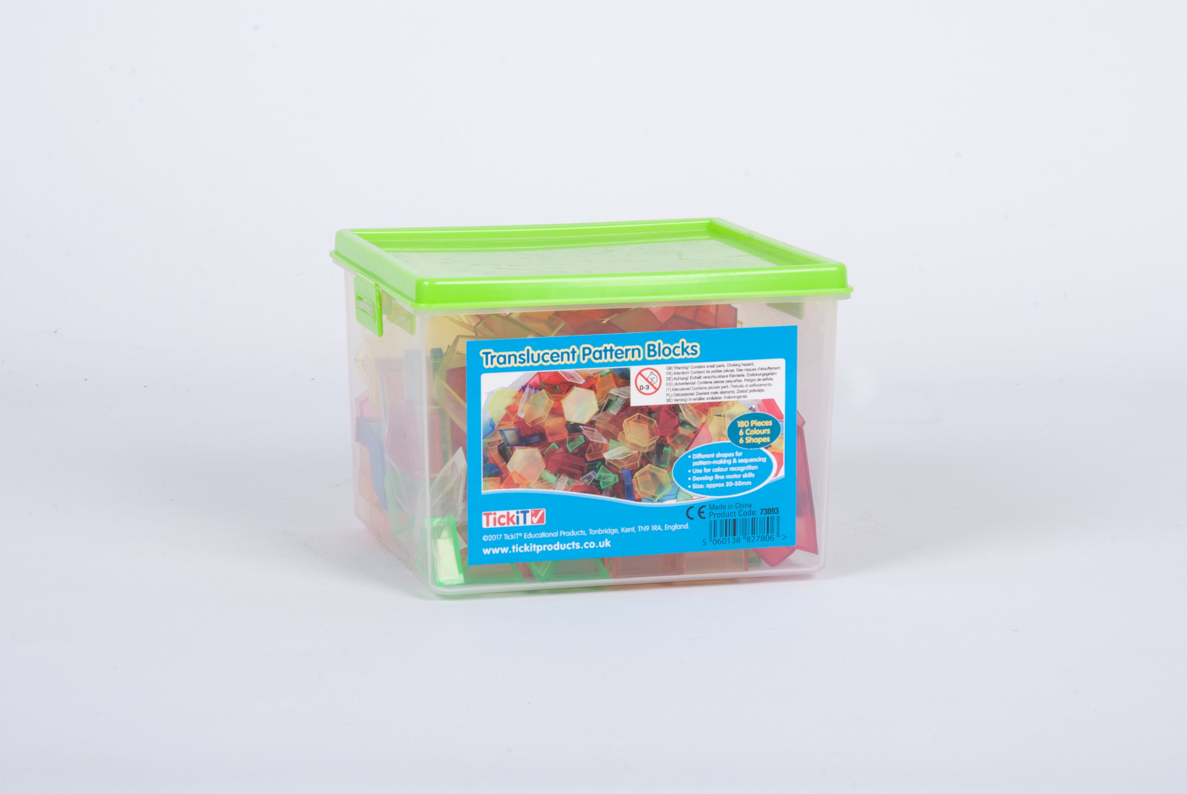 Green translucent storage container of translucent hollow pattern blocks, with printed front label