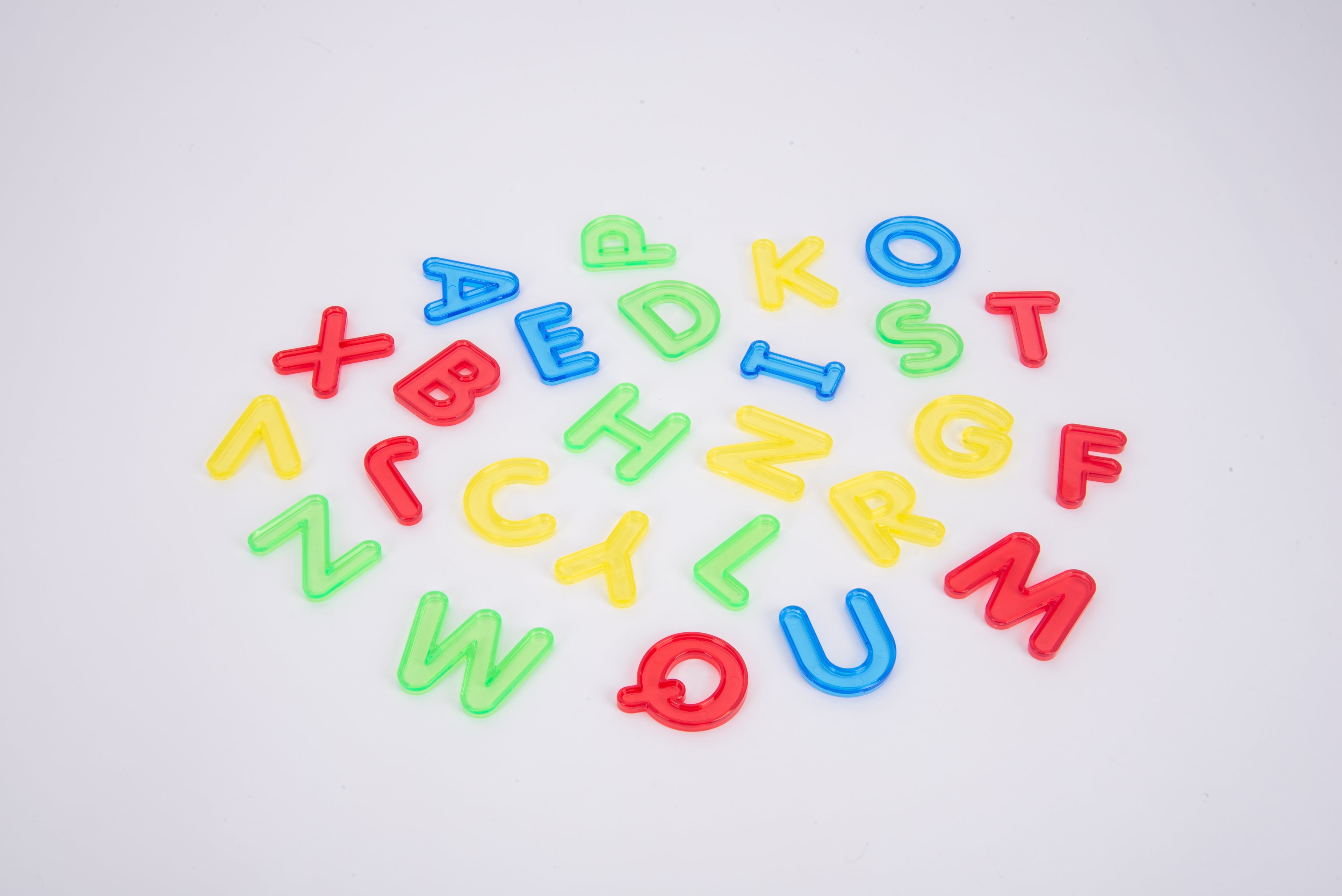 Translucent uppercase letter set with colorful letters A–Z arranged in a cluster