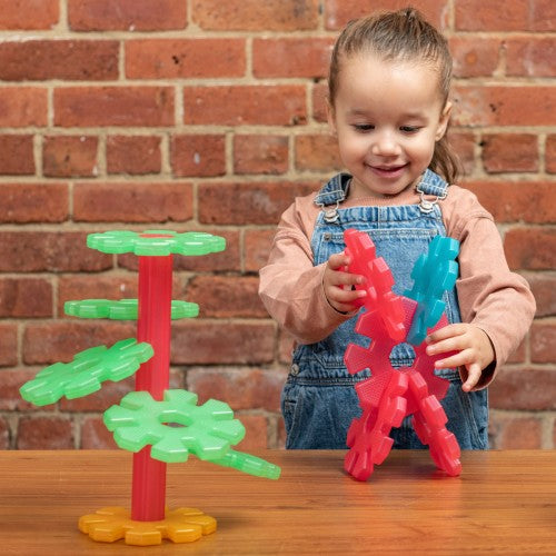 Translucent plastic building set with green base and red/blue interlocking pieces