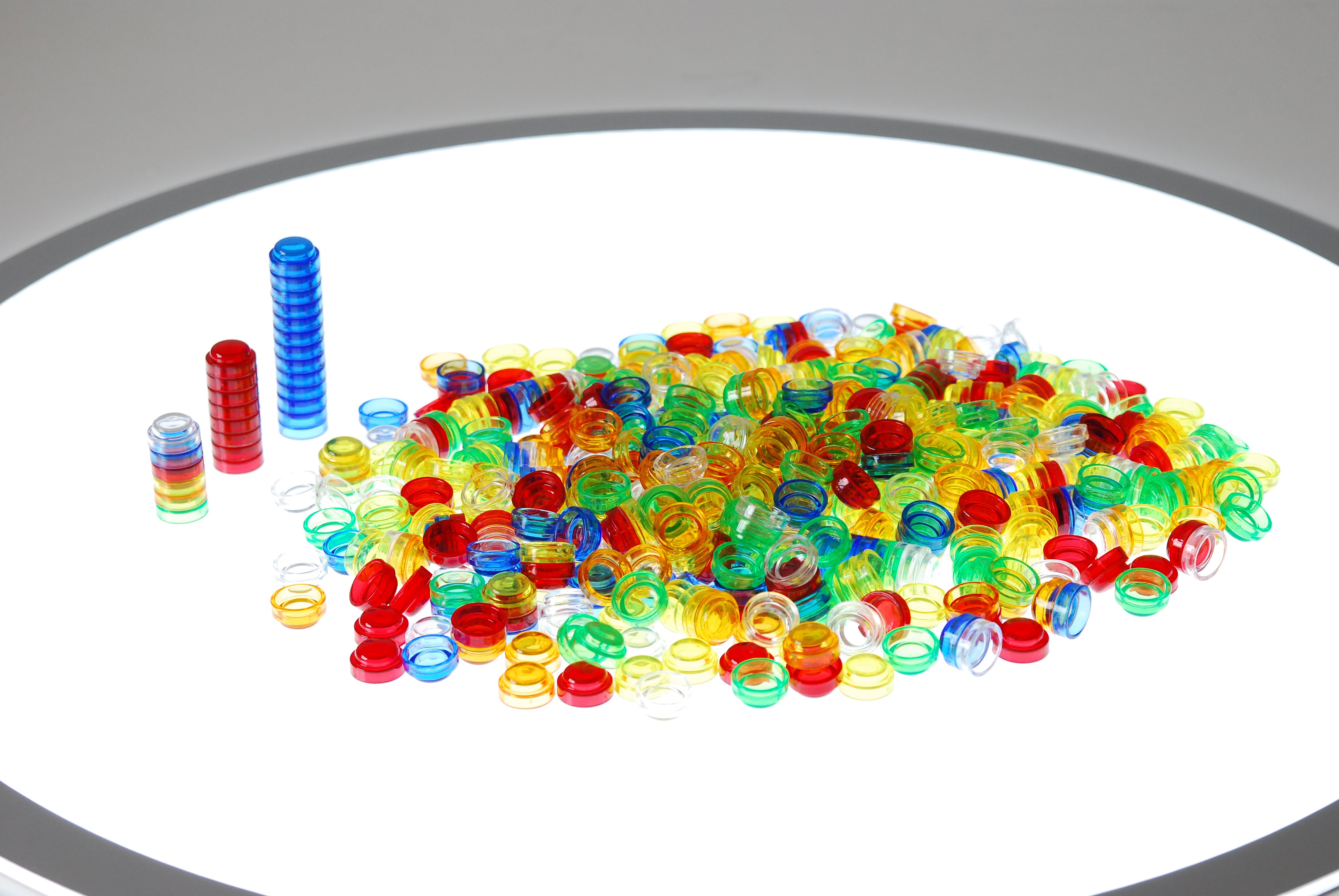 Colorful translucent counter rings and vertical stacking pegs
