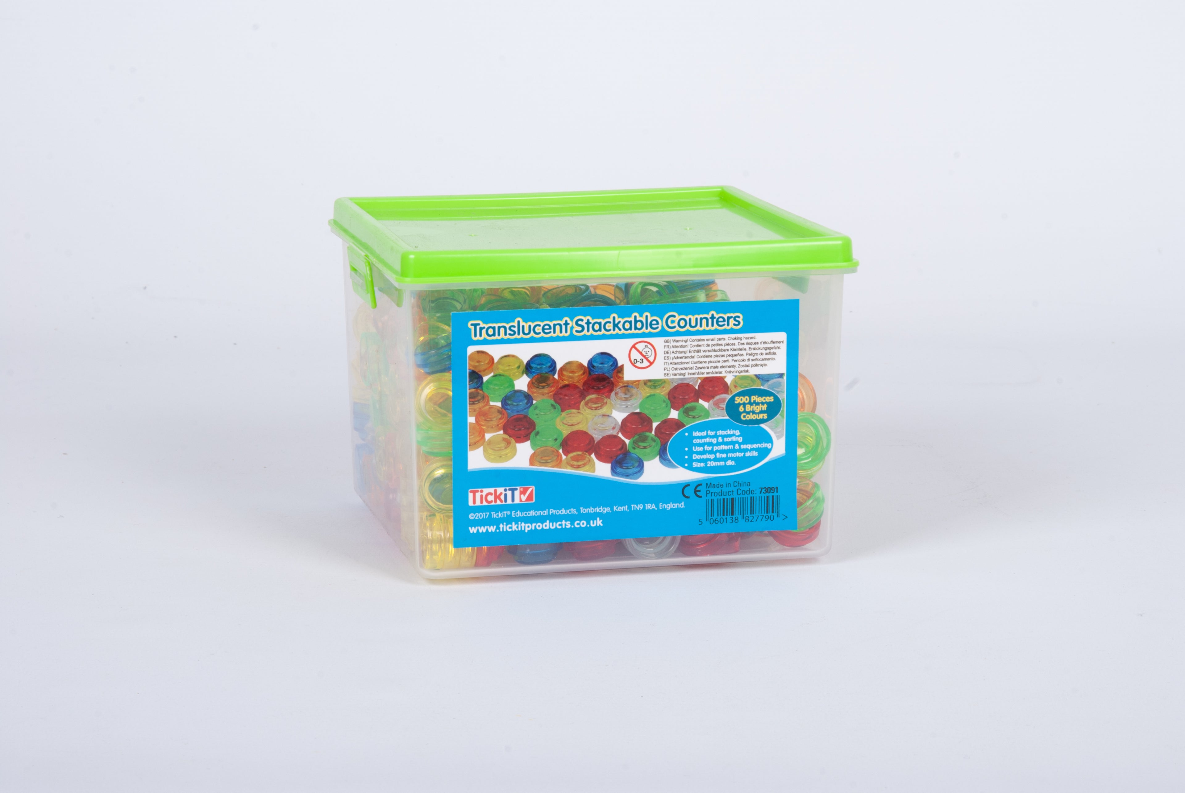 Translucent stackable counter container with green lid and colorful pieces