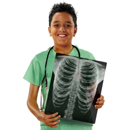 Human anatomy x-ray film held by a child in green scrubs