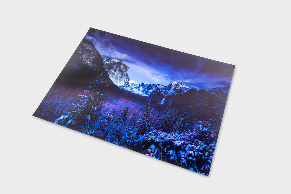 Winter-themed play mat with snowy mountain landscape in blue and purple tones