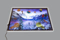 Play mat showing snowy mountains with colorful toy planets and floating shapes