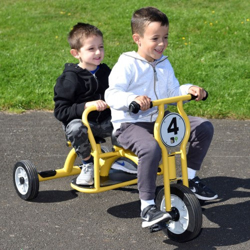Yellow kids tandem tricycle with two seats and front hand grips