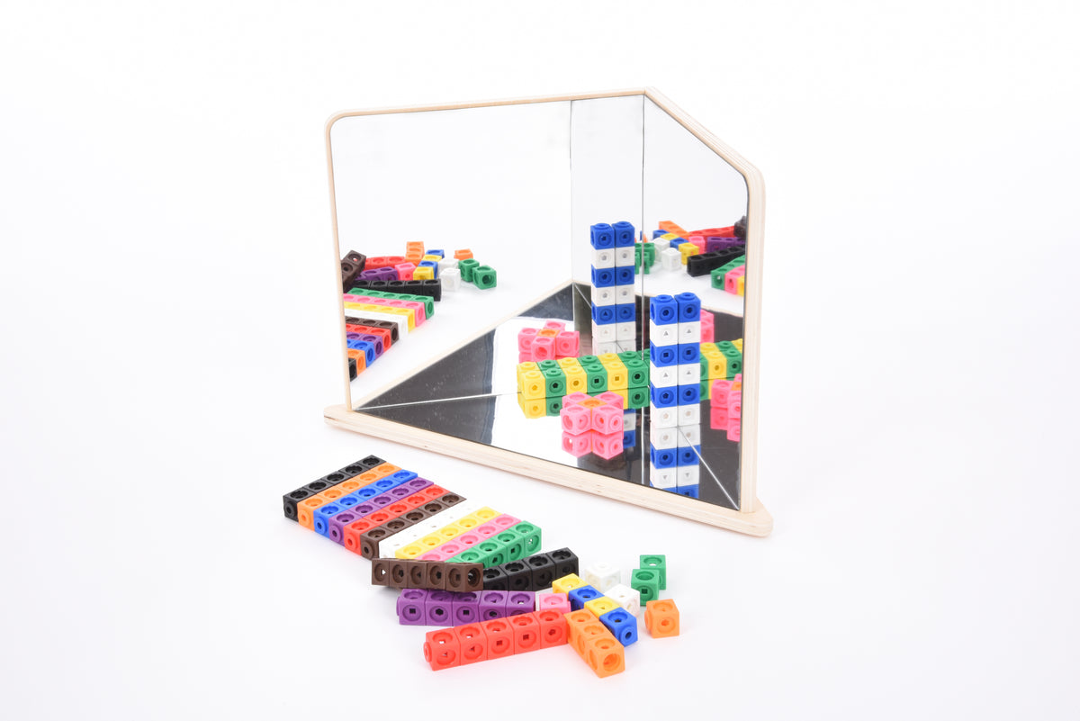 Wood-framed 4-way mirror reflecting multi-color building blocks and pieces