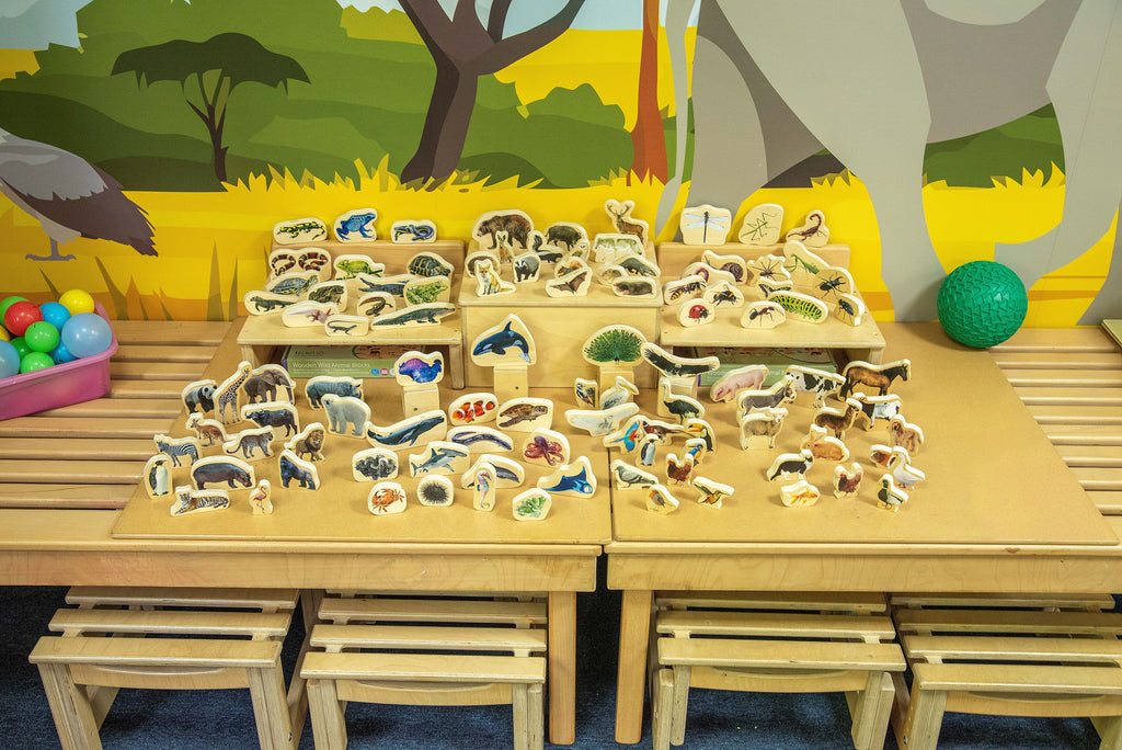 Wooden animal block set with stacked wooden boards of animal figures on display