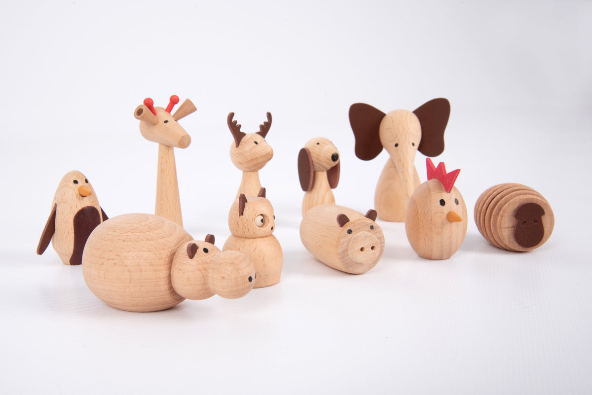 Assorted wooden animal friends figurines, including a spiral snail
