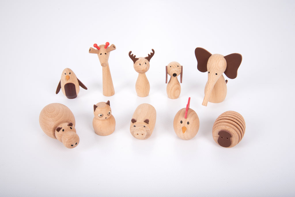 Assorted wooden animal figurines, featuring giraffe and bunny shapes