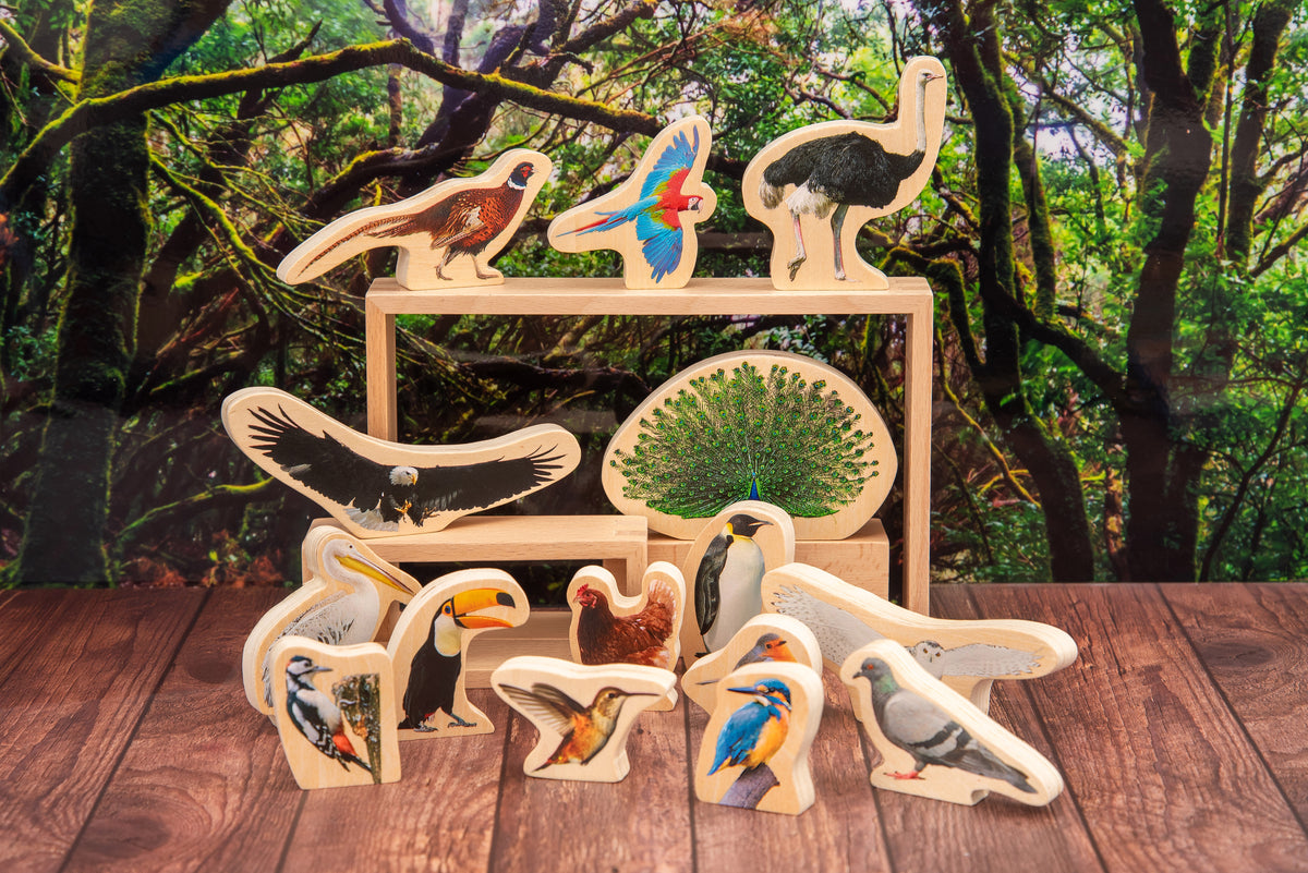 Wooden bird blocks displayed on a wooden stand with multiple bird figures