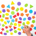 Colorful wooden buttons, mixed shapes and sizes—circles, stars, triangles and hexagons