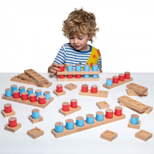 Wooden counting blocks set with colorful painted cylinder pieces and wood base blocks
