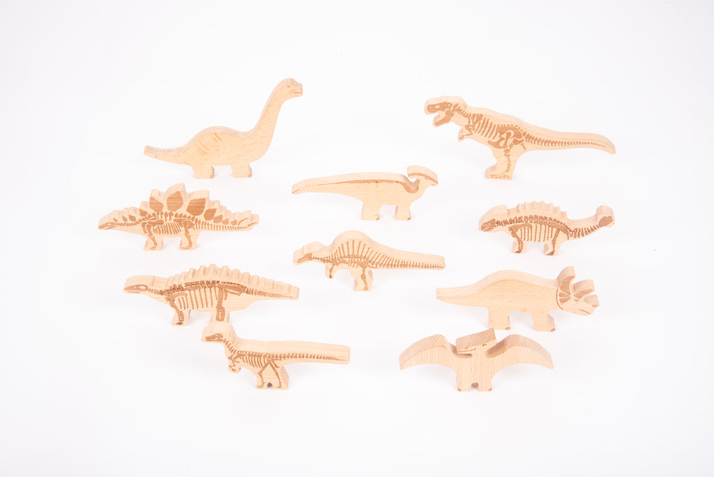 Wooden dinosaur blocks set showing different dinosaur shapes, carved from light wood