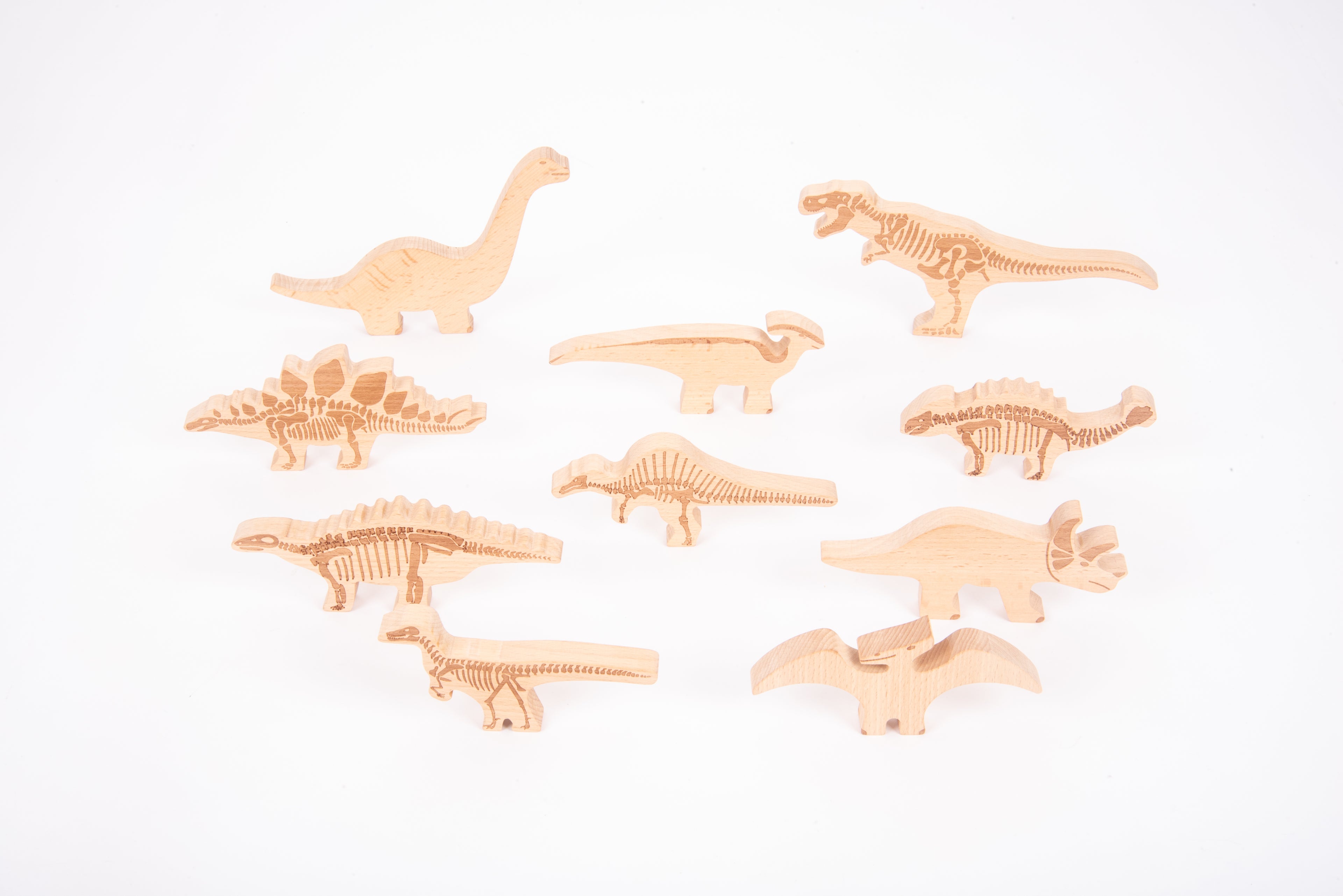 Wooden dinosaur blocks set showing different dinosaur shapes, carved from light wood