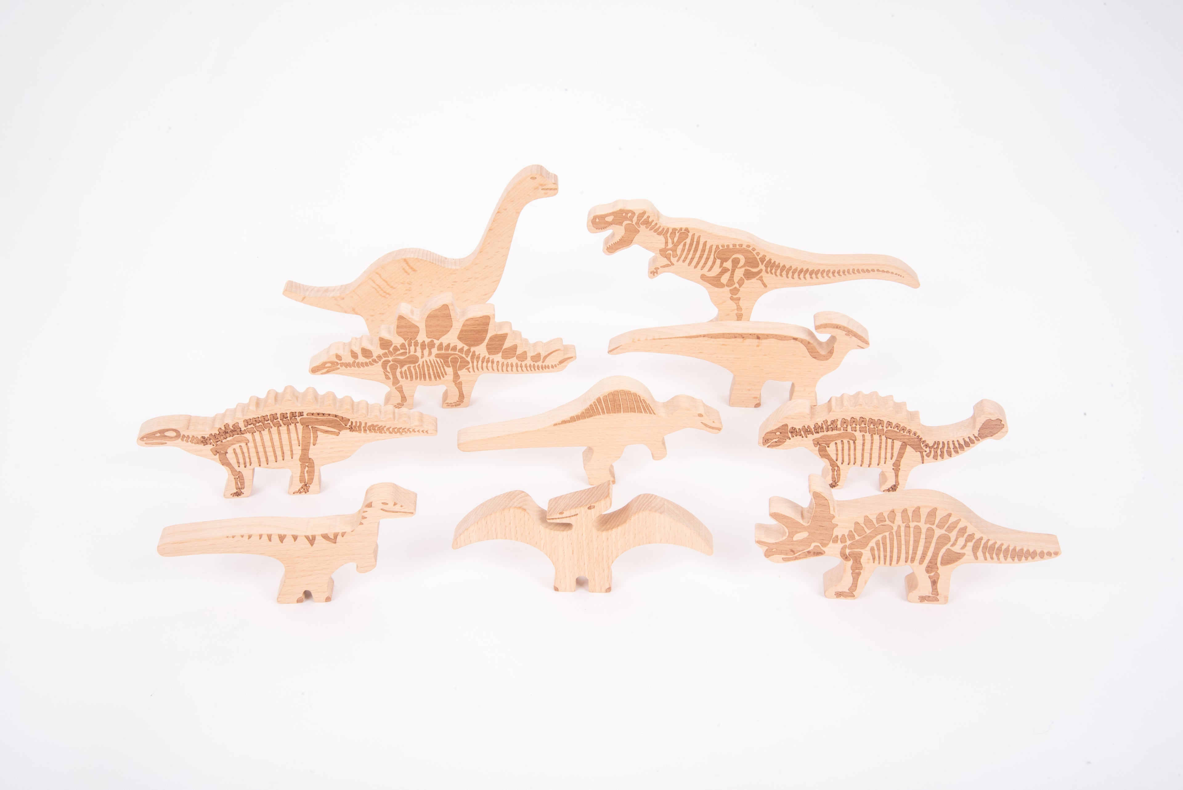 Wooden dinosaur blocks set with carved skeleton details in light wood, multiple pieces