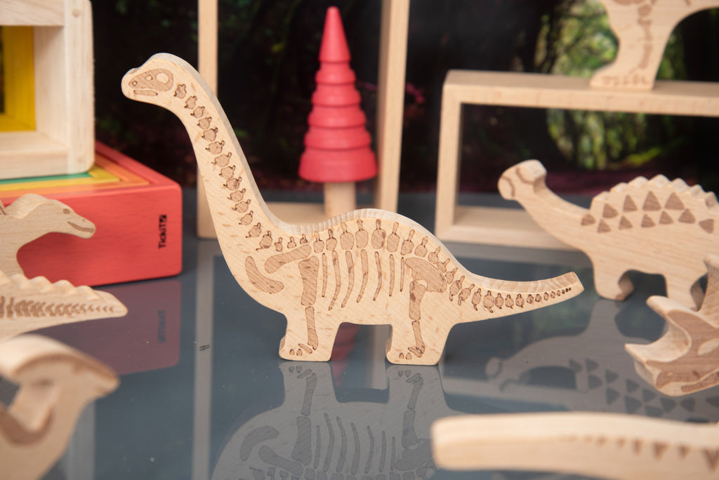 Tall-neck wooden dinosaur block with carved vertebrae, light wood